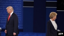 U.S. Democratic presidential candidate Hillary Clinton (right) and Republican presidential candidate Donald Trump arrive for the second presidential debate at Washington University in St. Louis on October 9.