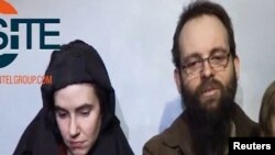 A video posted by the Taliban on social media on December 19, 2016 shows American Caitlan Coleman (left) speaking next to her Canadian husband, Joshua Boyle, and their two sons.