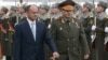 Armenia - Defense Ministers Seyran Ohanian (L) of Armenia and Sergey Shoygu of Russia inspect an Armenian honor guard before talks in Yerevan, 29Jan2013.