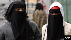 Muslim women wearing full-face veils in London. 