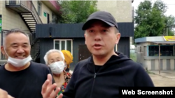 Aset Abishev speaks to reporters after his release from prison on July 30. 