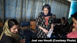 Afghanistan--Founder of 'Sahar Speaks' program Amie Ferris-Rottman (standing) in Kabul. March, 2016.