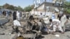 Pakistani security officials inspect the scene of a suicide bomb attack in Quetta on June 23.