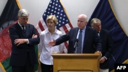 FILE: U.S. Senator John McCain (C) speaks at a press conference at Resolute Support headquarters in Kabul in July.