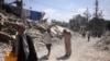 Palestinians flee their homes in Jabalia's Saftawy neighbourhood on August 26, 2025.