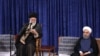 A handout picture released by the official website of the Iranian supreme leader Ayatollah Ali Khamenei shows him (L) speaking during the swearing in ceremony of Iranian President Hasan Rouhani (R) in Tehran on August 3.