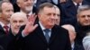 Bosnian Serb leader Milorad Dodik waves to people during parade celebrations to mark Republika Srpska's national holiday in Banja Luka on January 9, 2022.