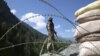 An Indian paramilitary soldier stands guard at a check post along a highway leading to Ladakh, at Gagangeer, some 81 kilometers from Srinagar, the summer capital of Indian Kashmir. (file photo)
