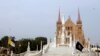 The flags of Vatican City (left) and Pakistan fly at half mast ahead of the funeral ceremony of the German-born nun Ruth Pfau, at the premises of the St. Patrick's Cathedral in Karachi on August 18.