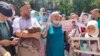 Supporters demand the release of Baibolat Kunbolat outside the Chinese Consulate in Almaty. 