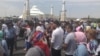 Arys residents protest near the Aqmeshit mosque on June 27.