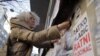 Aida Corovic protests against the mural celebrating convicted war criminal Ratko Mladic in Belgrade in November 2021.