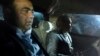 Pakistani Muttahida Qaumi Movement (MQM) political party top leader Farooq Sattar (R) and lawmaker Khawaja Izhar ul Hassan look on as they sit in a car after their arrest by paramilitary rangers in Karachi on August 22.