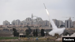 An Iron Dome launcher fires an interceptor rocket near the Israeli city of Ashkelon on November 19.