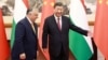 Chinese President Xi Jinping (right) welcomes Hungarian Prime Minister Viktor Orban at the Diaoyutai State Guesthouse in Beijing on July 8.