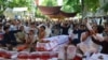 Pakistani Shi'ite Muslims stage a protest against the killing of their community members after twin bombing blasts on June 24 at a market in Parachinar, the capital of Kurram tribal district.