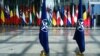 Flags of NATO and alliance member states are displayed at NATO headquarters in Brussels.